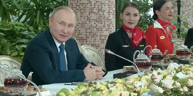 Russian President Vladimir Putin spoke to female flight attendants in comments broadcast on state television on Saturday, March 5, 2022. (Image: Reuters Video)