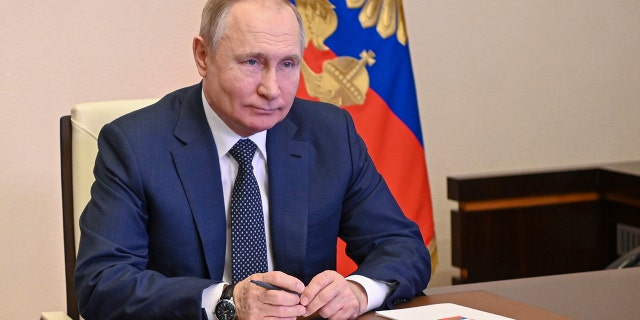 Russian President Vladimir Putin takes part in the launch of a new ferry via a conference call at the Novo-Ogaryovo residence outside Moscow on March 4, 2022.