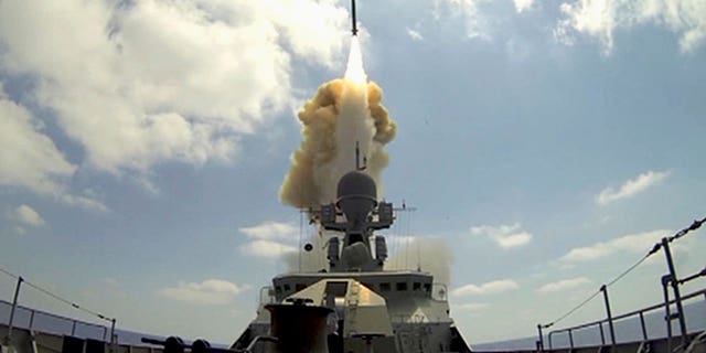   This image provided by the press service of the Russian Ministry of Defense shows the launch of a Kalibr long-range cruise missile from a Russian Navy ship in the eastern Mediterranean on Friday, August 8.  19, 2016. 