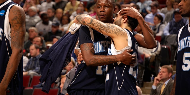 St. Peter's College Wesley Jenkins (15) and Nick Leon (21) upset after losing game to Purdue at United Center, Chicago