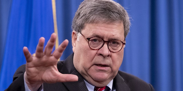 Attorney General William Barr speaks during a news conference at the Department of Justice in Washington, Dec. 21, 2020.