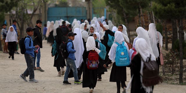 Afghan students leave school classes in a primary school in Kabul, Afghanistan on March 27, 2021.
