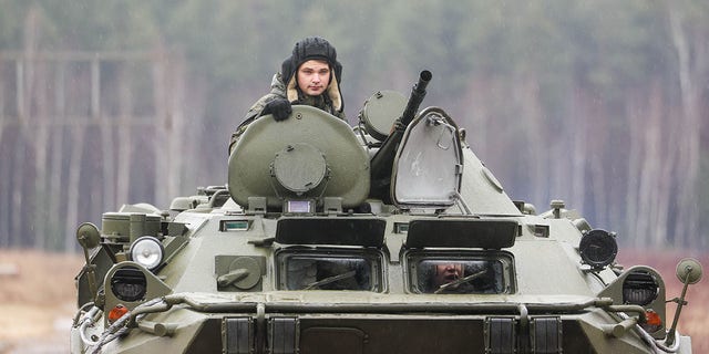 Cadets ride a BTR-80 armoured personnel carrier during an open practical training session in which they practised reconnaissance skills, responded to simulated accidents at hazardous facilities, and provided camouflage make-up services for strategic sites, at the Moscow Regions No 282 Joint Force Training Centre for Russian Army Radiological, Chemical and Biological Defence Troops, in the village of Bolshoye Bunkovo. Gavriil Grigorov/TASS 