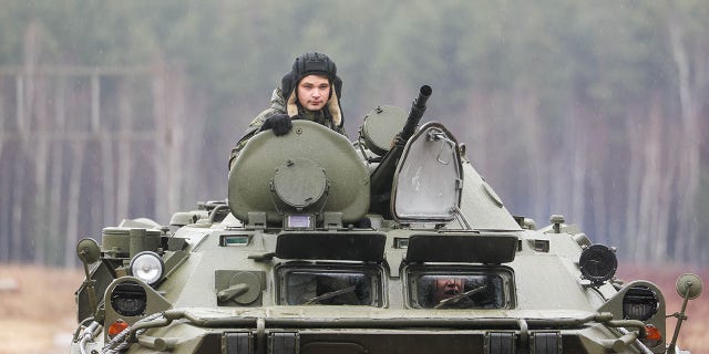 Cadets ride a BTR-80 armoured personnel carrier during an open practical training session in which they practised reconnaissance skills, responded to simulated accidents at hazardous facilities, and provided camouflage make-up services for strategic sites, at the Moscow Regions No 282 Joint Force Training Centre for Russian Army Radiological, Chemical and Biological Defence Troops, in the village of Bolshoye Bunkovo. Gavriil Grigorov/TASS 