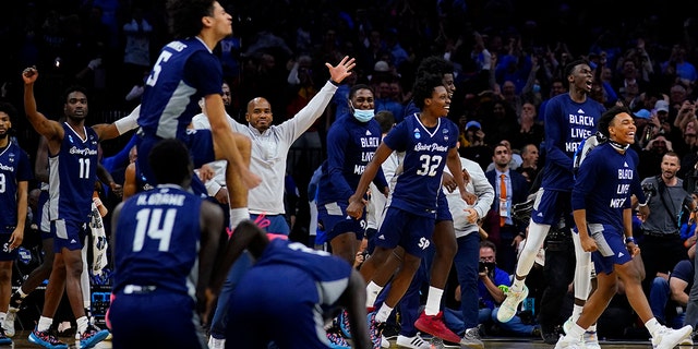 Saint Peter's celebrates after winning a college basketball game against Purdue in the Sweet 16 round of the NCAA tournament, Friday, March 25, 2022, in Philadelphia.