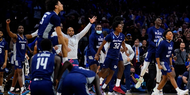 Saint Peter's celebrates after winning a college basketball game against Purdue in the Sweet 16 round of the NCAA tournament, Friday, March 25, 2022, in Philadelphia.
