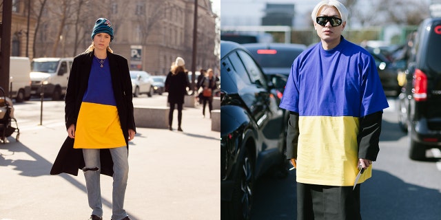 Model Kiki Willems and blogger Bryan Boy pose in Balenciaga yellow and blue Ukraine flag shirts in early March during Paris Fashion Week.