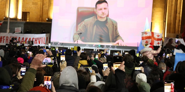 Thousands of demonstrators gather around the Parliament building in Tbilisi, Georgia, during a protest against Russia's attacks on Ukraine, March 04, 2022. Ukrainian President Volodymyr Zelenskyy addressed the rally in a video message.