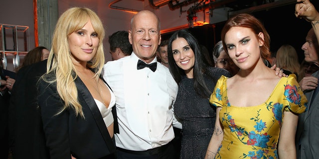 (L-R) Rumer Willis, Bruce Willis, Demi Moore and Tallulah Belle Willis attend the after party for the Comedy Central Roast of Bruce Willis in Los Angeles, California in 2018. 