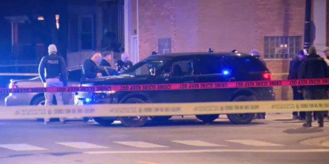 A Chicago police officer suffered a gunshot wound to a hand while another suffered a leg injury when a shootout ensued during a traffic stop late Monday, authorities said.