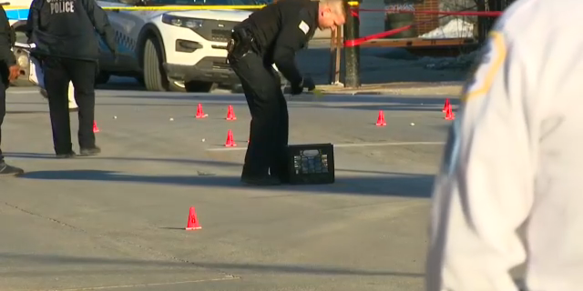 The shooting occurred outside a Little Caesars pizzeria in the 7900 block of South Exchange Avenue on Sunday, police said