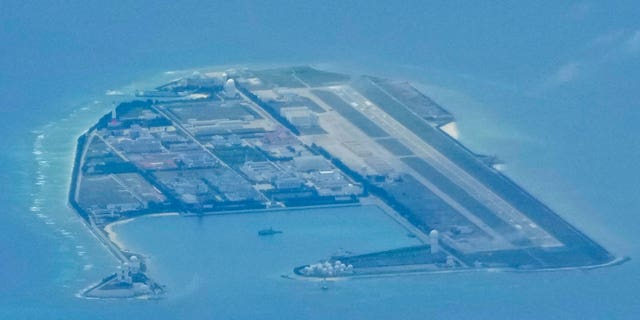 Chinese structures and buildings are seen at the manmade island of Mischief Reef in the South China Sea in March 2022.
