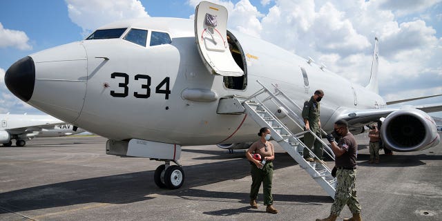 Admiral John C. Aquilino, commander of the U.S. Indo-Pacific Command (INDOPACOM), exits a U.S. P-8A Poseidon reconnaissance plane at Clark Air Base, Pampanga province, northern Philippines Sunday, March 20, 2022.Â