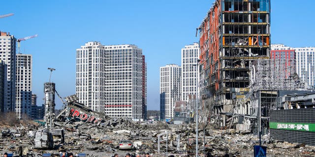 Wreckage and debris outside a damaged shopping centre in the Podilskyi district of Kyiv by Russian air strikes, amid Russian invasion, in Kyiv, Ukraine, 21 March 2022. Russian invasions have forced millions of Ukrainians to become refugees fleeing to other countries.