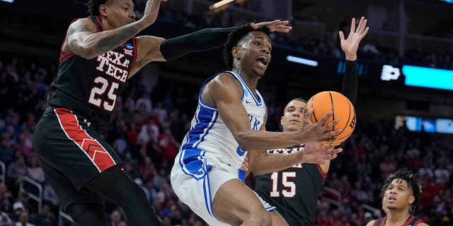 Duke guard Jeremy Roach, middle, is defended between Texas Tech guard Adonis Arms (25) and guard Kevin McCullar Jr. (15) during the second half of a college basketball game in the Sweet 16 round of the NCAA tournament in San Francisco, Thursday, March 24, 2022.