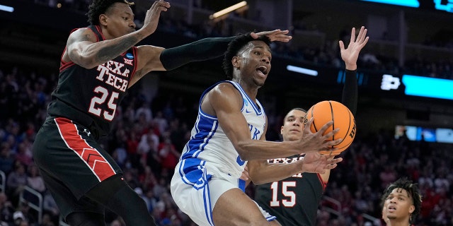 Duke guard Jeremy Roach, middle, is defended between Texas Tech guard Adonis Arms (25) and guard Kevin McCullar Jr. (15) during the second half of a college basketball game in the Sweet 16 round of the NCAA tournament in San Francisco, Thursday, March 24, 2022.