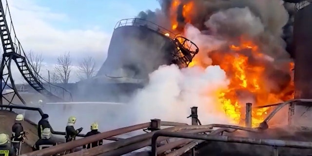 These images show Ukrainian firefighters tackling a blaze at an industrial fuel storage company in Lutsk, Ukraine, following a Russian missile strike on the facility.