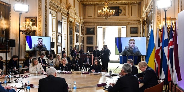 Ukraine's President Volodymyr Zelensky addresses by video link attendees at a meeting of the leaders of the Joint Expeditionary Force (JEF) at Lancaster House on March 15, 2022 in London.