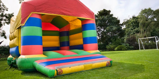 Jennifer Beane shared video on Facebook of a bounce house coming loose and nearly smashing into a child in her backyard.