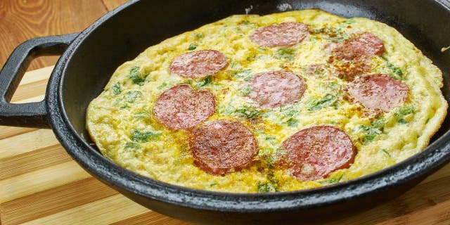 Some TikTok users make pizza eggs with fresh-cracked eggs and popular pizza toppings while others make pizza eggs with actual leftover pizza slices and scrambled eggs.