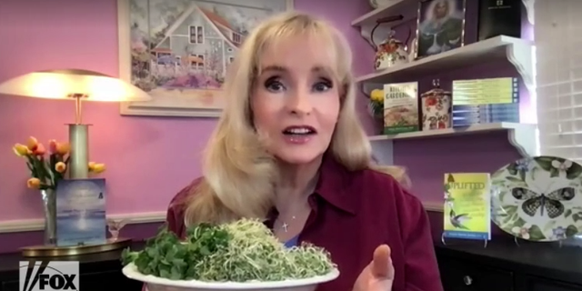 Health expert Susan Smith Jones, PhD, holds a plate of sprouts grown in her kitchen, on Tuesday, March 22, 2022. (Fox News Digital)
