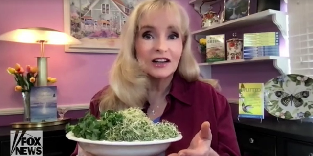 Health expert Susan Smith Jones, PhD, holds a plate of sprouts grown in her kitchen, on Tuesday, March 22, 2022. (Fox News Digital)