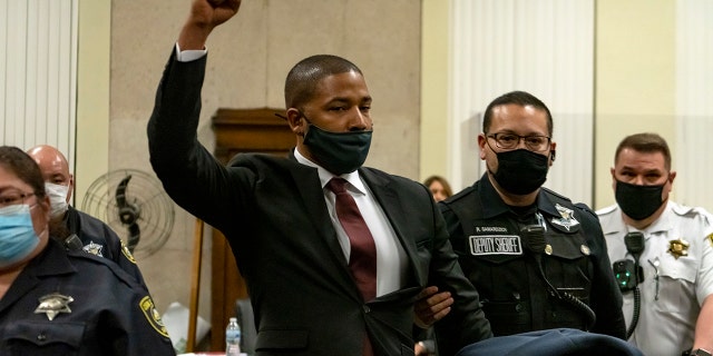 Jussie Smollett is led out of the courtroom after being sentenced at the Leighton Criminal Court Building on March 10, 2022 in Chicago, Illinois. Jussie Smollett was found guilty late last year of lying to police about a hate crime after he reported to police that two masked men physically attacked him, yelling racist and anti-gay remarks near his Chicago home in 2019. He was sentenced to 150 days in jail, 30 months probation, ordered to pay $120,000 restitution to the city of Chicago and fined $25,000.