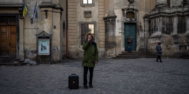 A man recites a poem on March 19, 2022, in downtown Lviv, Western Ukraine, the last outpost before Poland and host to hundreds of thousands of Ukrainians streaming through or staying on.