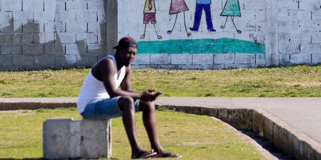 A migrant rests in the Krnjaca refugee center near Belgrade, Serbia, Thursday, Feb. 24, 2022.