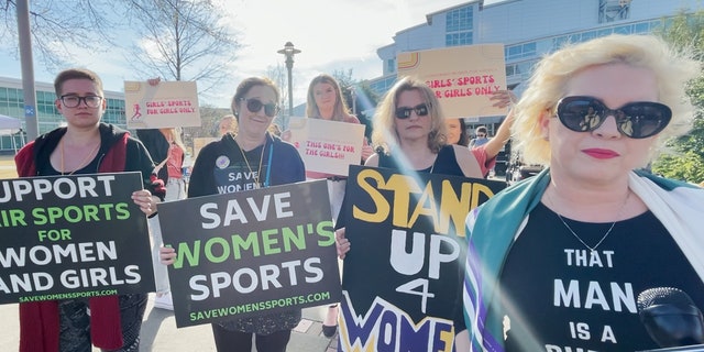 Feminists protest transgender woman Lia Thomas of the University of Pennsylvania's participation in the NCAA Division I swimming and diving championships.