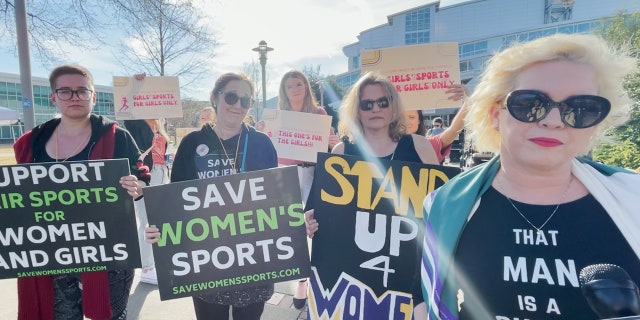 Feminists protest transgender woman Lia Thomas of the University of Pennsylvania's participation in the NCAA Division I swimming and diving championships.