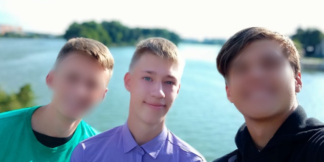 Matthew Frantsuzhan, who is studying music in Iowa, is shown in a picture with two friends from Ukraine.