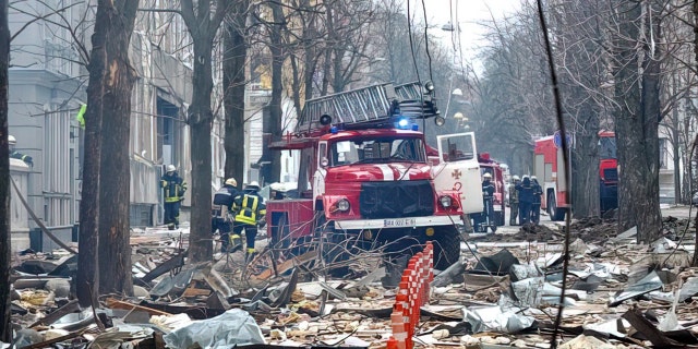Firefighters work to contain a fire in the complex of buildings housing the Kharkiv regional SBU security service and the regional police, allegedly hit during recent shelling by Russia, in Kharkiv on March 2, 2022.