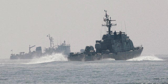 South Korean navy patrol ships search for survivors from a sunken South Korean navy ship near South Korea's Baekryeong island, March 29, 2010.