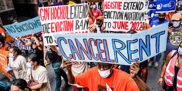 FILE - Housing activists march across town toward New York Gov. Kathy Hochul's office, calling for an extension of pandemic-era eviction protections, Tuesday, Aug. 31, 2021, in New York. Leaders of New York's Democratic-controlled Legislature want to boost funding for housing, child care and home care in this year's budget. Legislative leaders are negotiating with Gov. Kathy Hochul to pass a budget by April 1, 2022. (AP Photo/Mary Altaffer, File)