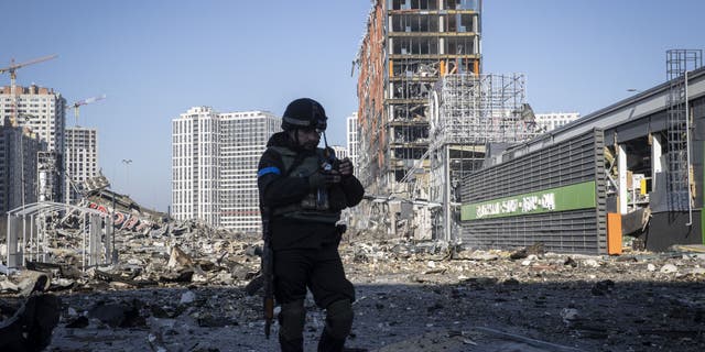 A view of destroyed buildings and vehicles after Russian attacks on a shopping mall, in Kyiv, Ukraine on March 21, 2022. It is reported that, 8 people were killed in the Russian attack on shopping mall. (Photo by Emin Sansar/Anadolu Agency via Getty Images)