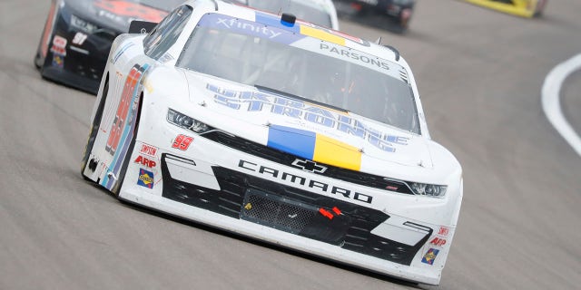 Stefan Parsons' #99 B.J. McLeod Motorsports Chevrolet featured a "Ukraine Strong" livery during the NASCAR Xfinity Series race in Las Vegas.