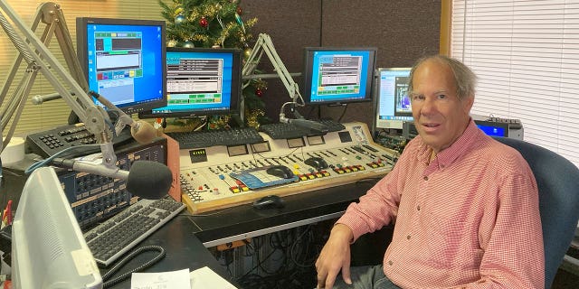 Peter Schartel, who runs a small radio company in Liberty, Mo., poses on March 17, 2022. The suburban Kansas City radio station, KCXL, is facing criticism for airing Russian state-sponsored programming in the midst of the Ukrainian war.