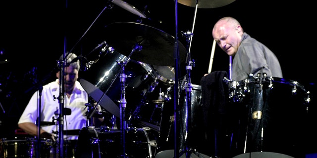  Phil Collins plays the drums during the First Final Farewell Tour at the Staples Center in Los Angeles, United States on August 31, 2004.