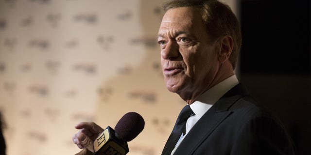 Comedian Joe Piscopo speaks to reporters as he arrives for the Mark Twain prize for Humor honoring Eddie Murphy at the Kennedy Center in Washington October 18, 2015.