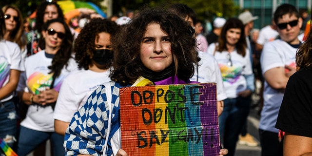 Members and supporters of the LGBTQ community attend the "Say Gay Anyway" rally in Miami Beach, Florida on March 13, 2022.