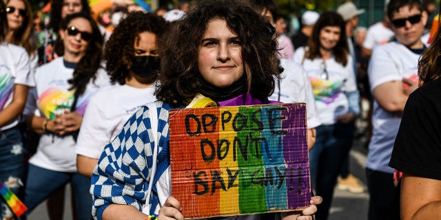 Members and supporters of the LGBTQ community attend the "Say Gay Anyway" rally in Miami Beach, Florida on March 13, 2022.