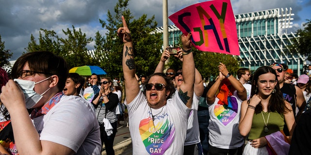 Members and supporters of the LGBTQ community attend the "Say Gay Anyway" rally in Miami Beach, Florida on March 13, 2022. (Photo by CHANDAN KHANNA / AFP) (Photo by CHANDAN KHANNA/AFP via Getty Images)