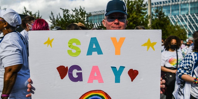 Members and supporters of the LGBTQ community attend the "Say Gay Anyway" rally in Miami Beach, Florida on March 13, 2022. - Florida's state senate on March 8 passed a controversial bill banning lessons on sexual orientation and gender identity in elementary schools, a step that critics complain will hurt the LGBTQ community. Opposition Democrats and LGBTQ rights activists have lobbied against what they call the "Don't Say Gay" law, which will affect kids in kindergarten through third grade, when they are eight or nine years old. (Photo by CHANDAN KHANNA / AFP) (Photo by CHANDAN KHANNA/AFP via Getty Images)