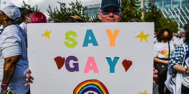 Members and supporters of the LGBTQ community attend the "Say Gay Anyway" rally in Miami Beach, Florida on March 13, 2022. - Florida's state senate on March 8 passed a controversial bill banning lessons on sexual orientation and gender identity in elementary schools, a step that critics complain will hurt the LGBTQ community. Opposition Democrats and LGBTQ rights activists have lobbied against what they call the "Don't Say Gay" law, which will affect kids in kindergarten through third grade, when they are eight or nine years old. (Photo by CHANDAN KHANNA/AFP via Getty Images)