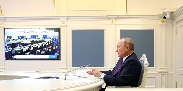 Russian President Vladimir Putin attends a session of the G20 Leaders' Summit in Rome, via teleconference in Moscow, on Oct. 30, 2021.