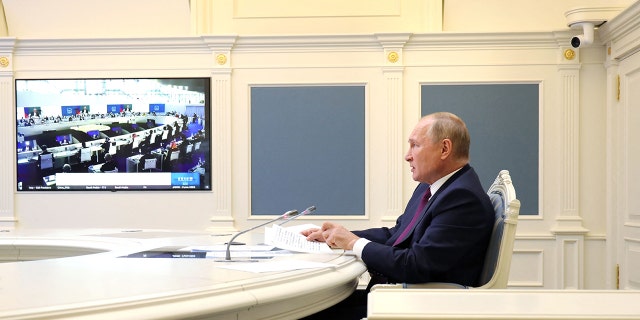 Russian President Vladimir Putin attends a session of the G20 Leaders' Summit in Rome, via teleconference in Moscow, on Oct. 30, 2021.