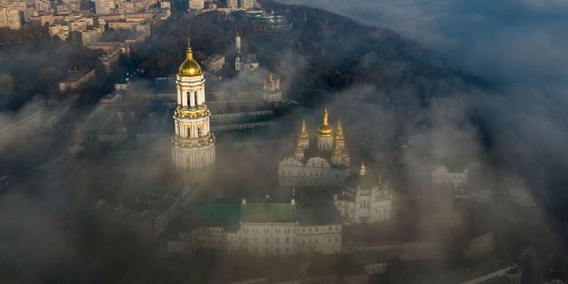 Morning fog surrounds the thousand-year-old Monastery of the Caves, also known as Kyiv-Pechersk Lavra, one of the holiest sites of Eastern Orthodox Christians, in Kyiv, Ukraine, on Saturday, Nov. 10, 2018. As the capital braces for a Russian attack in 2022, the spiritual heart of Ukraine could be at risk. 