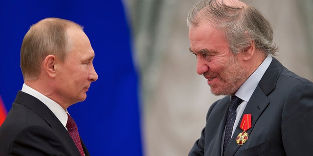 Russian President Vladimir Putin, left, presents a medal to Valery Gergiev, then the Mariinsky Theatre's artistic director, during an awards ceremony in Moscow.
