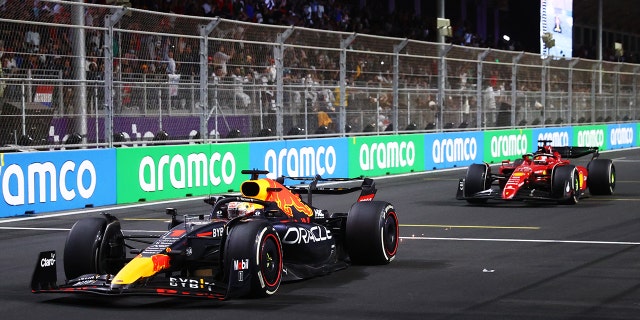 Max Verstappen of the Netherlands driving the (1) Oracle Red Bull Racing RB18 leads Charles Leclerc of Monaco driving (16) the Ferrari F1-75 during the F1 Grand Prix of Saudi Arabia at the Jeddah Corniche Circuit March 27, 2022, in Jeddah, Saudi Arabia.